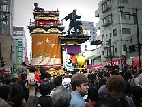 A person on top of float is kind of guide who watched around there