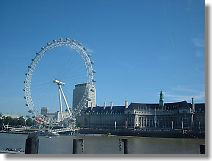 Ferris wheel or London Eye is 135m in height, and has large boxes with 25 seats. Right building is the London Aquarium combined with the London County Hall.