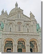 white sacred building on the hill of Montmartre with the name of sacred heart